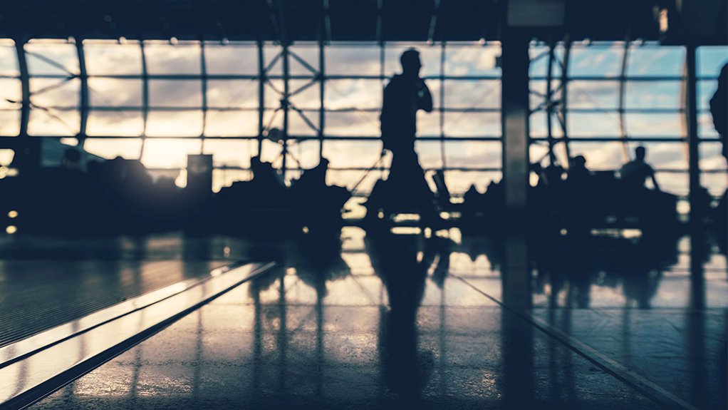 Pic of silhouettes in airport.