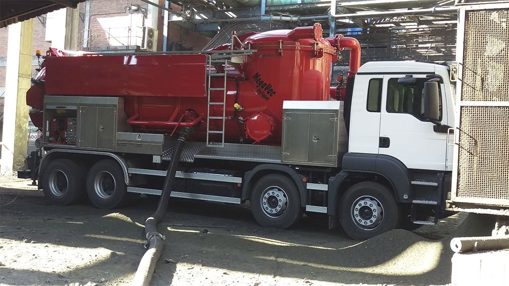 An image of a large red truck fitted with vacuum pump and tank used for acid plant sludge spillage recovery 