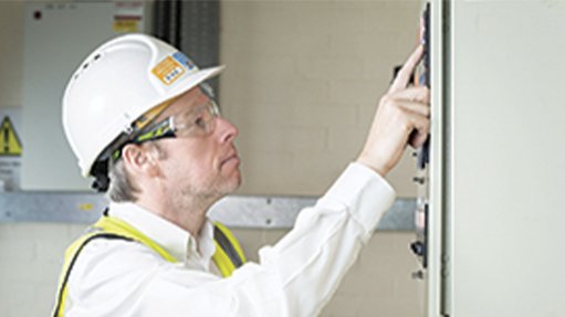 An image of a man checking the alarm system