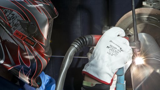 Image of a welder working in an aerospace manufacturing facility 