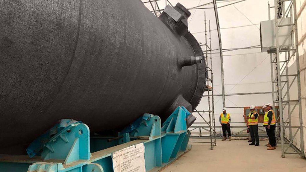 A photo of the Energoatom delegation inspecting an AP1000 reactor vessel stored at a US facility