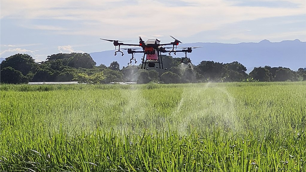 Image of a DJI T30 Agras spraying drone