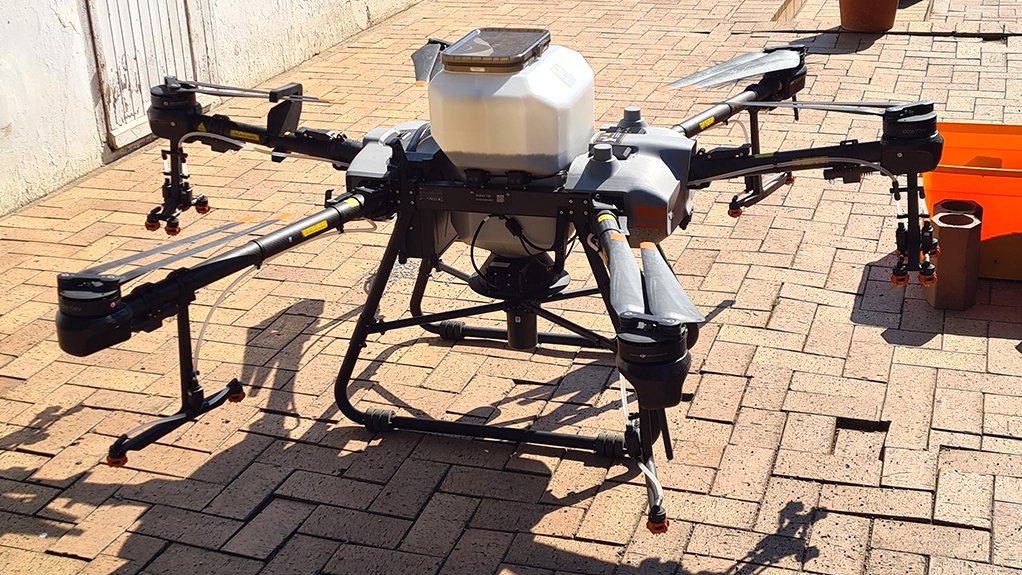 Image of a DJI T30 Agras spraying drone
