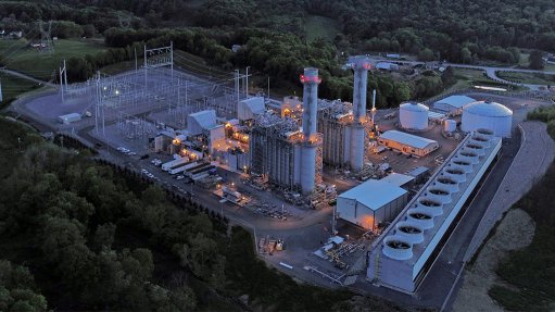 A large Gas Power Combined Cycle power plant designed by GE at dusk