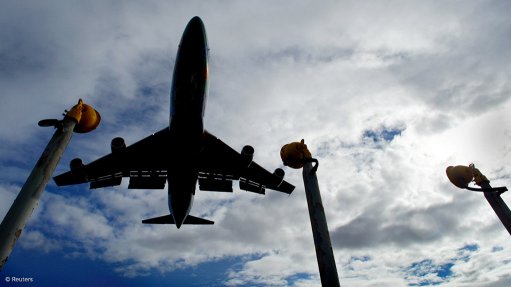 An image of an aeroplane landing on a runway