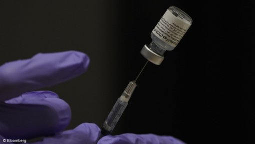 Image shows a close op of a Covid vaccine and needle 