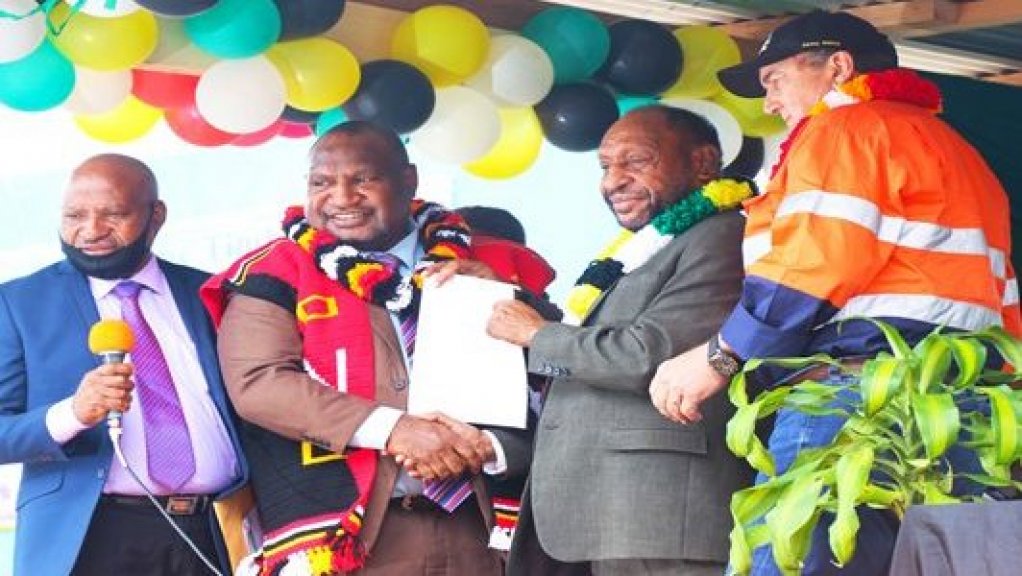Image shows Mark Bristow and Papua New Guinea officials.