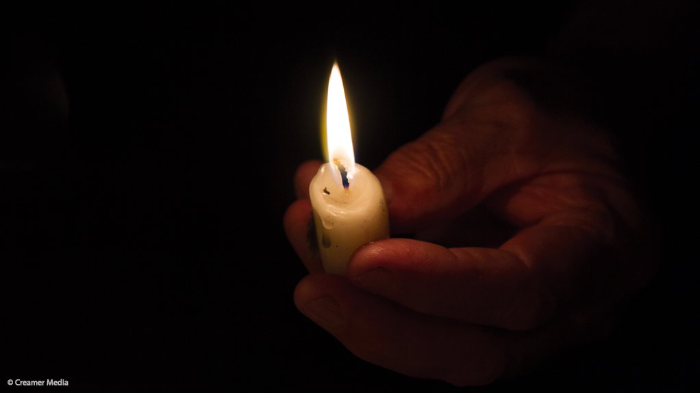 Image of a lit candle during load shedding 