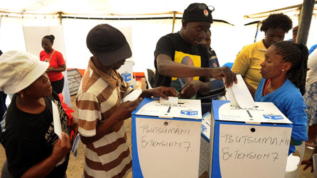 Image of voters casting their votes 