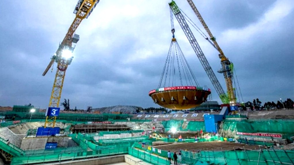 A photo of the ACP100 reactor containment vessel bottom head being craned into position