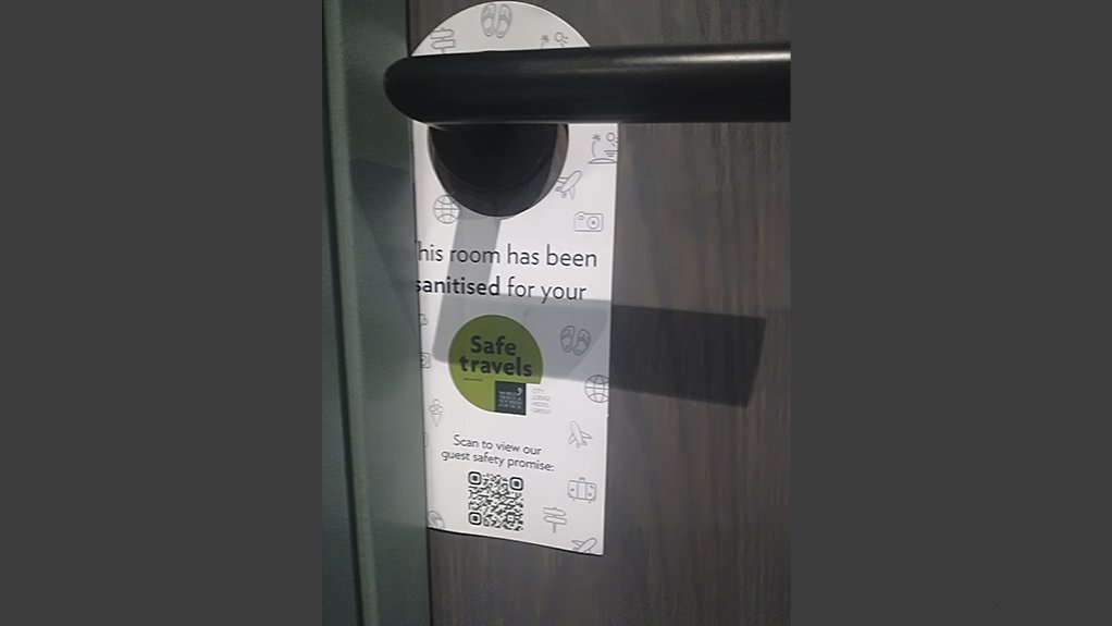 An image showing that the room at the Courtyard Hotel has been sanitised, and the QR code 
