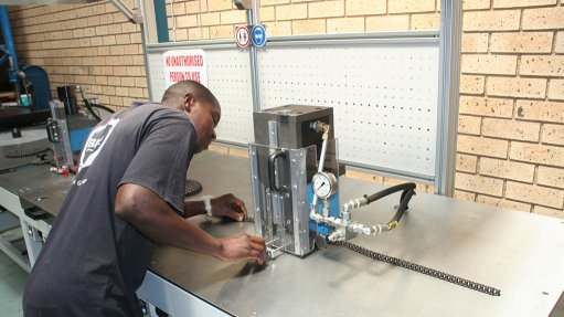 Image of a BMG worker conducting maintenance, specification 