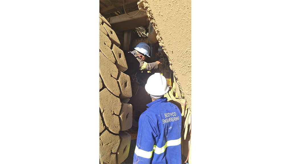 A Booyco Engineering technician successfully completing an installation on a mining vehicle
