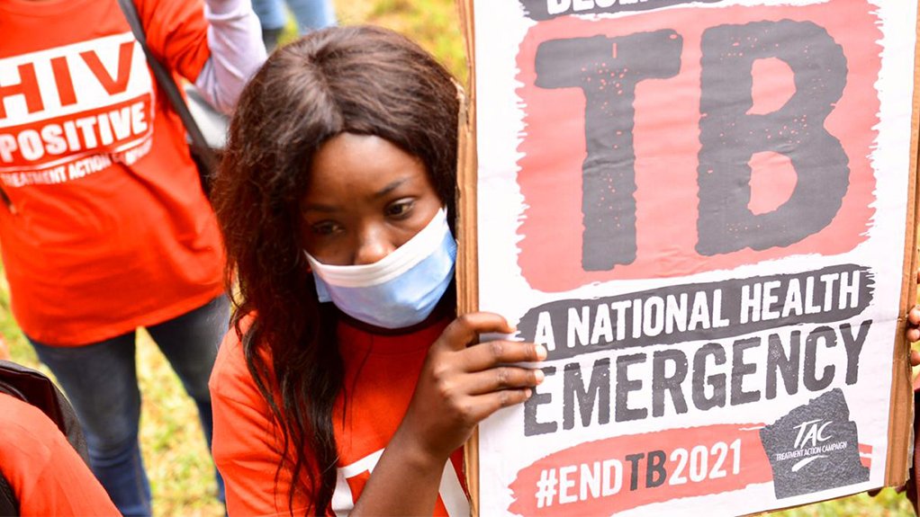 image of a woman carrying a TB poster