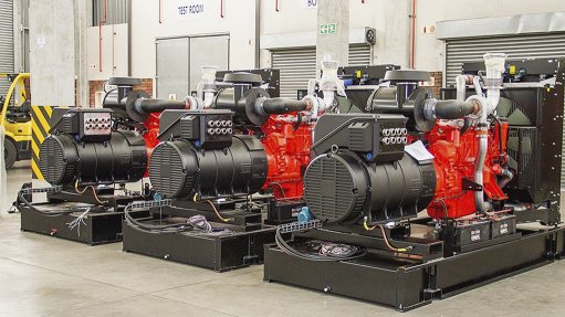 A photo of three gensets side by side in a room.
