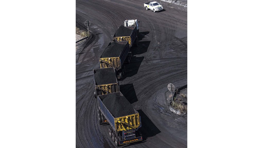 A four part road train full of ore on an openpit mine