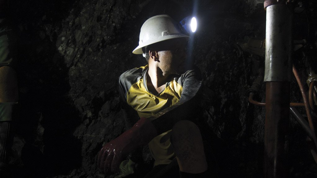 An employee working underground at one of Sibanye-Stillwater's gold operations