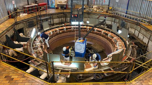 A photo of M&C technicians working in the large area left inside the stator after removal of the rotor at Eskom’s Drakensburg Hydro pump storage power station