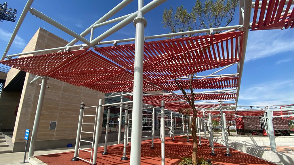 A red roof made of Y8 Rebar bent at various angles to create a Swoosh effect for client Nike at the Shapa Soweto Training Centre