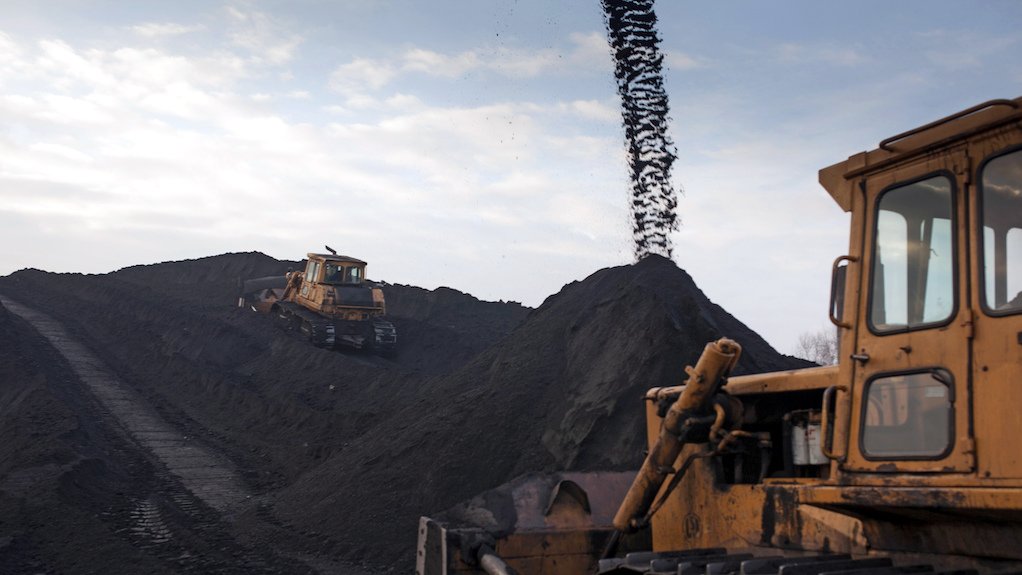 Image of coal spout with truck in the foreground