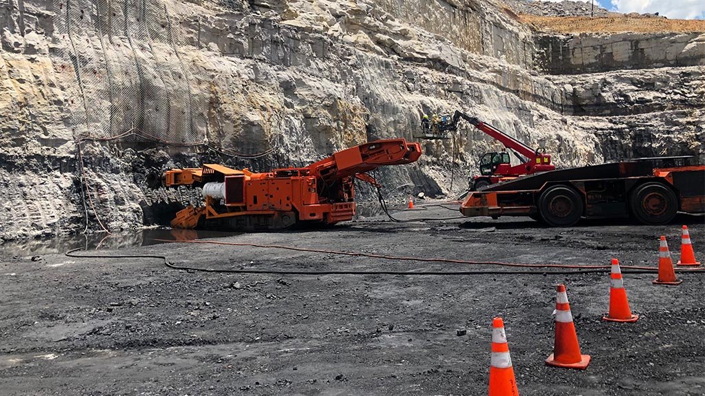 A photo of a continuous miner cutting into the coal face