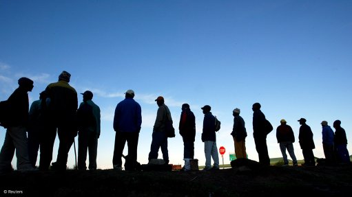 A photo of unemployed workers lining up for work