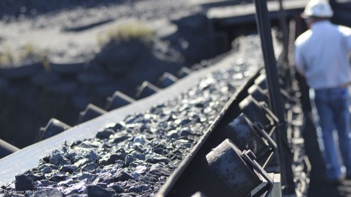 A photo of coal on a conveyor