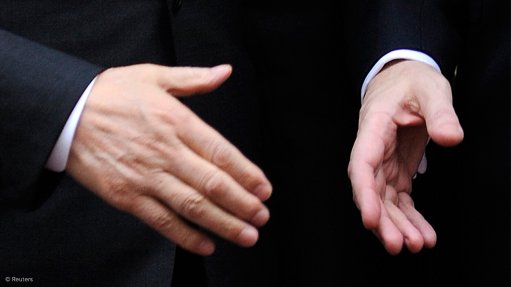 Image shows a handshake 