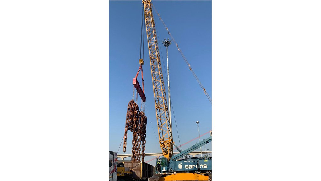 Yellow CC1100 crane lifting heavy chains 