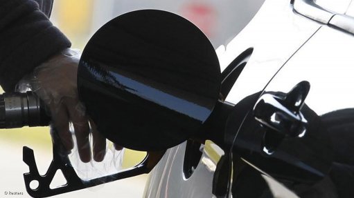An attendee pumping petrol