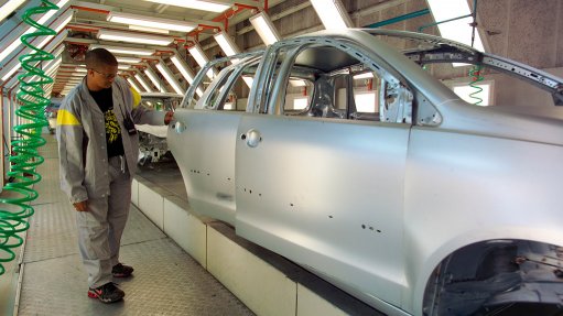 Image of a vehicle in spray booth inside a plant
