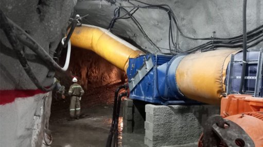 Large yellow pipes and a filtration system in a mine in Brazil that allow for fresh air to be pumped into the shaft for better breathing