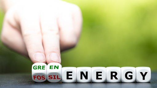 Image of somebody replacing the word fossil with the words green energy