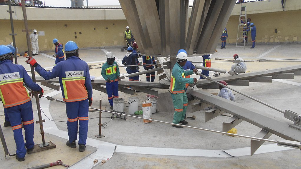 Work commenced with the repair of the bases of the two concrete tanks, with workers lowered down the 6m-high structures using rope-suspended platforms