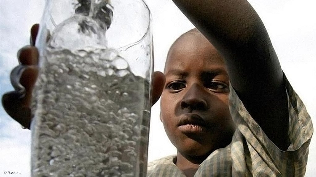 Image of a boy with a glass of water