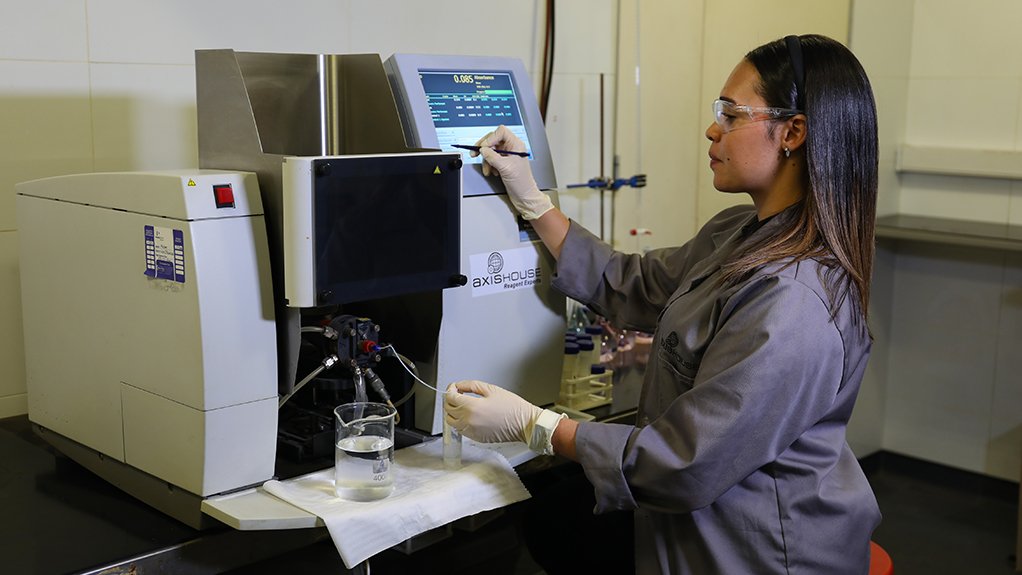 Image of an Axis House employee working on reagents 