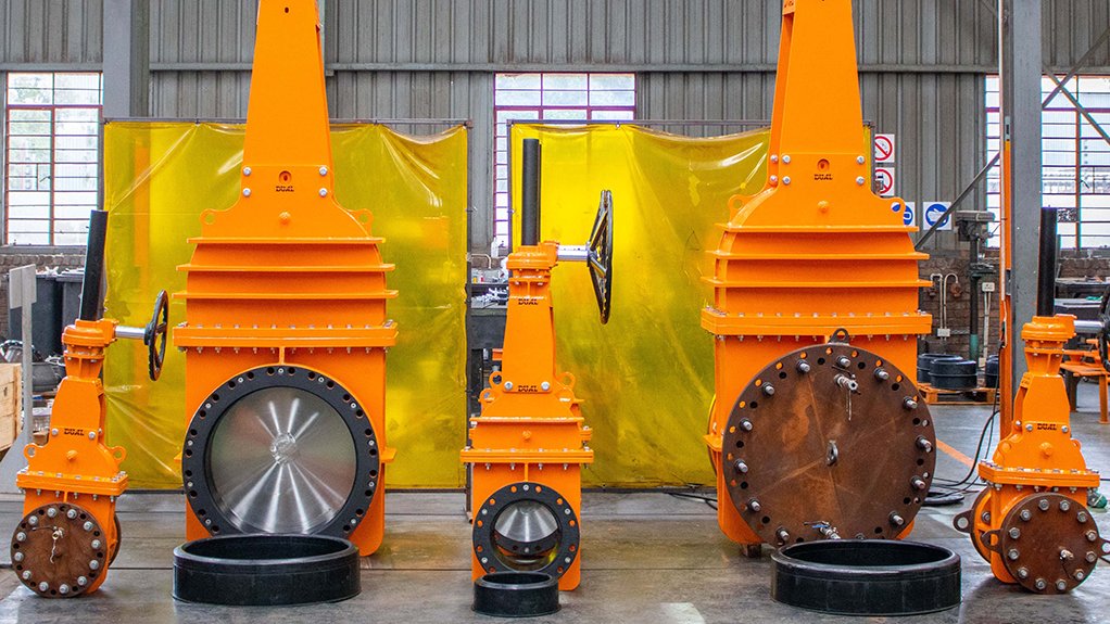 An image depicting orange manual gear and hydraulically operated valves