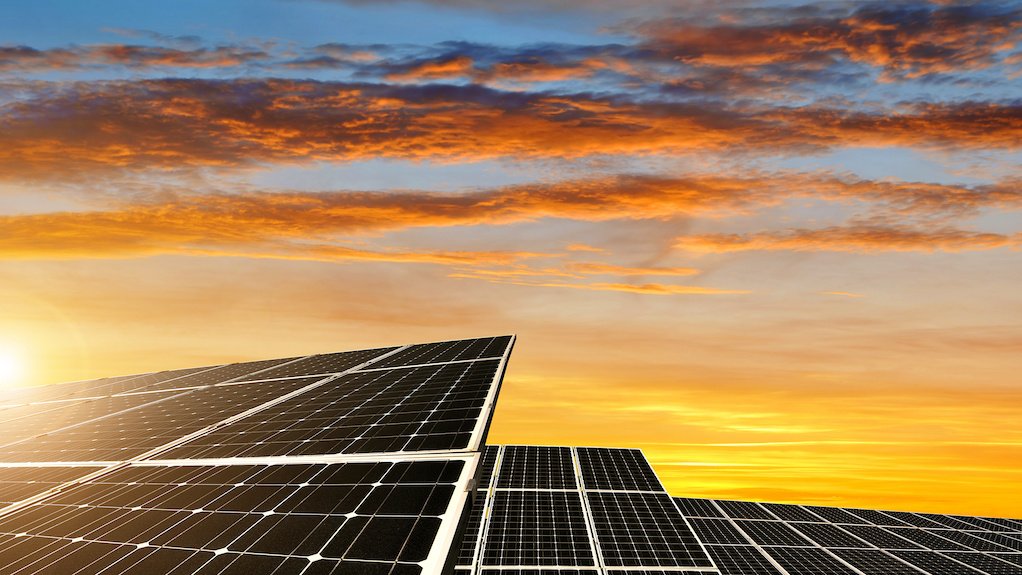 Image of solar panels at sunset