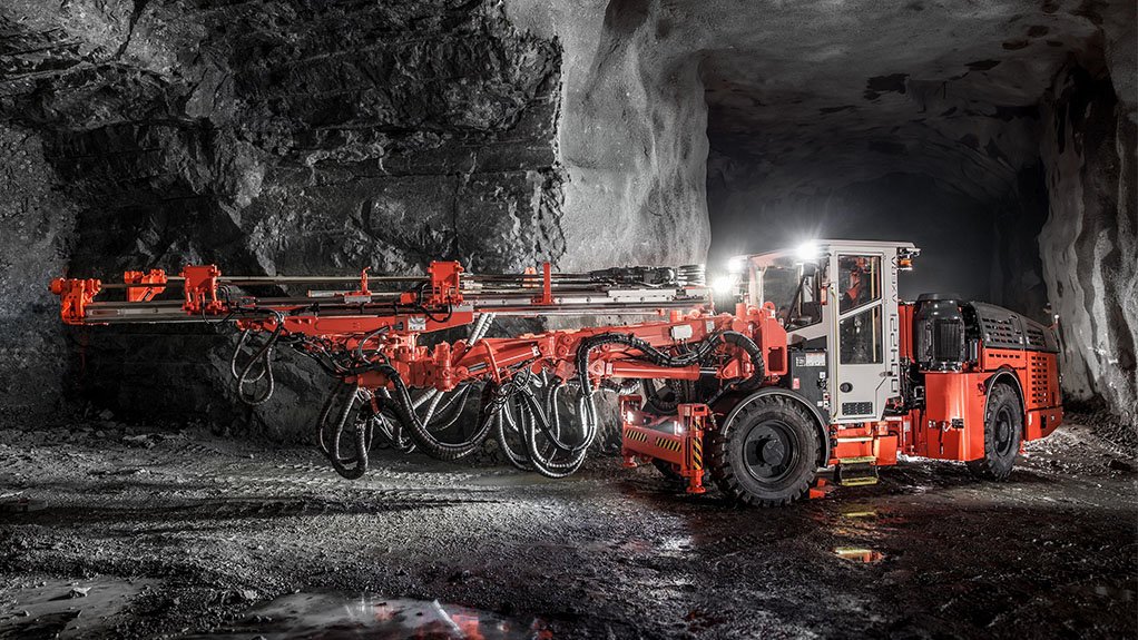 A large red underground mining automatic drilling rig supplied by Sandvik which is being taken up by the Southern African market again