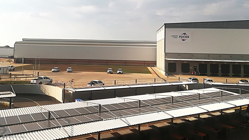 An image showing Fuchs SA's warehouse and some solar panels 
