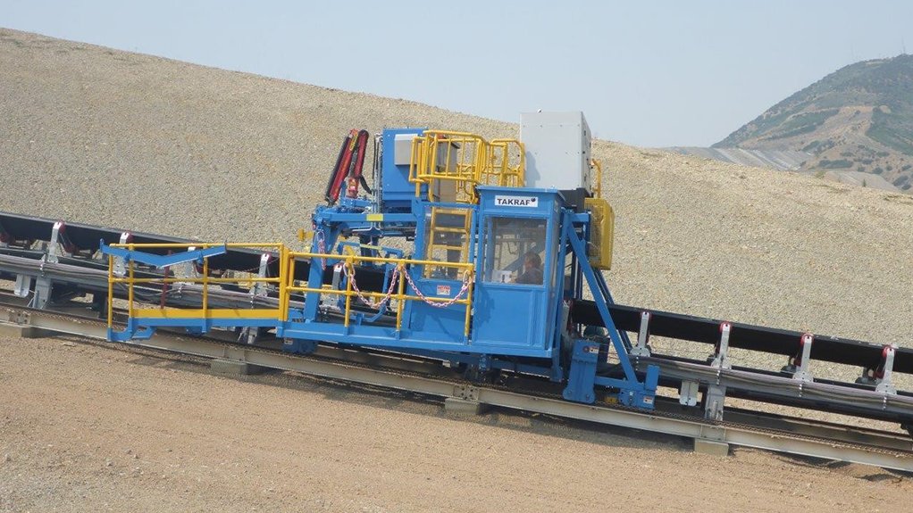 An image depicting the blue and yellow TAKRAF maintenance cart on a steep 26% decline section at a copper mine, in the US