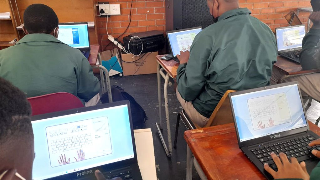 Image showing Eric Louw High School learners using laptops donated by Anglo American