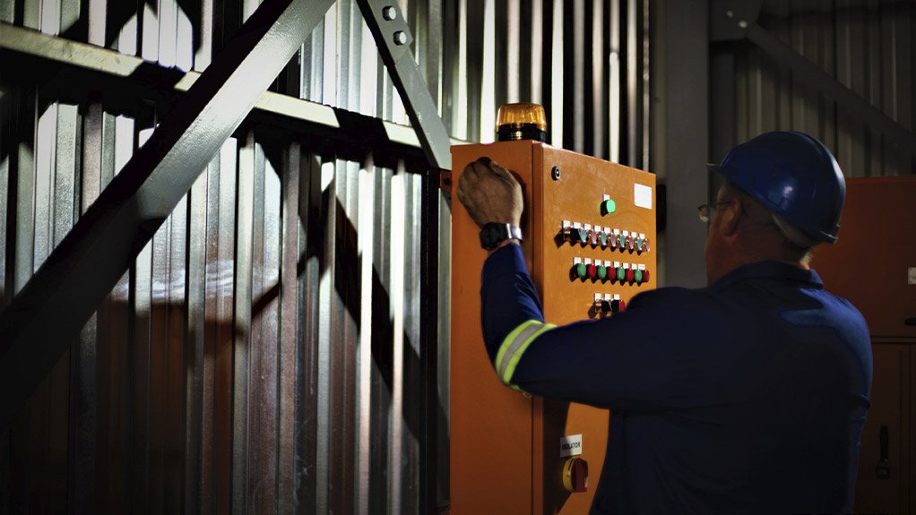 An image of a man fixing a boiler