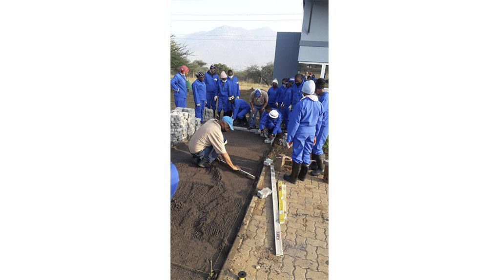 The theoretical and practical instruction in brick paving was provided by Kevin Vena and Benjamine Mlambo
