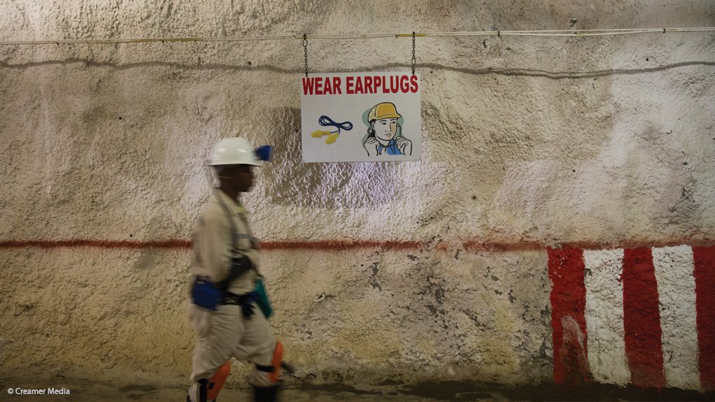 A Sibanye employee working in an underground gold mine
