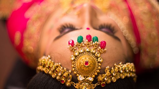 An image of a woman's gold head piece 