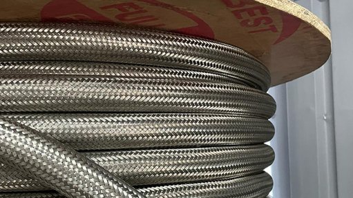 A reel of stainless steel braided hose which is impervious to fire chemicals and pressure