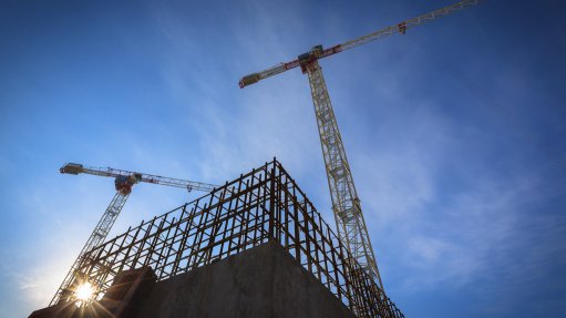 construction of building with cranes