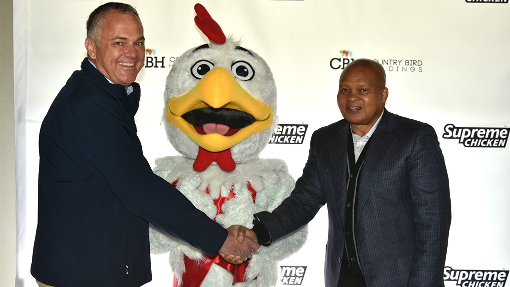An image of CBH CEO Brendon de Boer and North West Premier Kaobitsa Bushy Maape, with the CBH mascot 