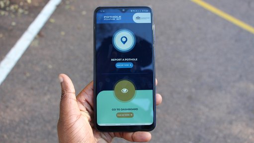 Photo of mobile phone with PotholeFixGP app on screen. The GDRT and the CSIR have launched the PotholeFixGP app